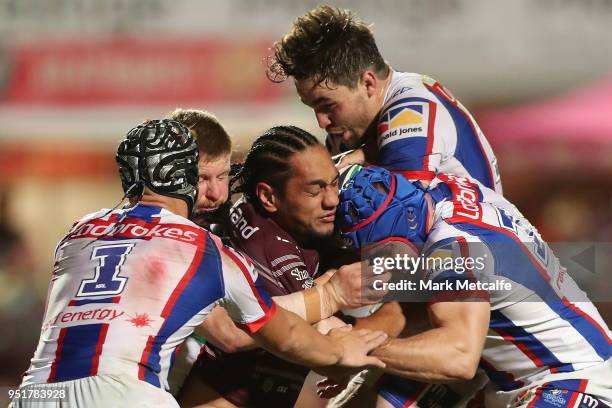 Martin Taupau of the Sea Eagles is tackled during the Round eight NRL match between the Manly-Warringah Sea Eagles and the Newcastle Knights at...