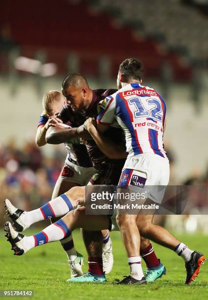 Addin Fonua-Blake of the Sea Eagles is tackled during the Round eight NRL match between the Manly-Warringah Sea Eagles and the Newcastle Knights at...