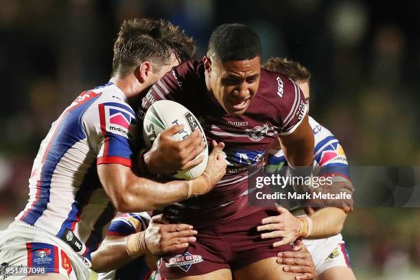 Jacob Saifiti of the Knights is tackled during the Round eight NRL match between the Manly-Warringah Sea Eagles and the Newcastle Knights at...