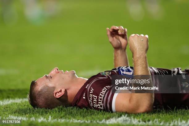 Lachlan Crocker of the Sea Eagles lays down injured during the Round eight NRL match between the Manly-Warringah Sea Eagles and the Newcastle Knights...