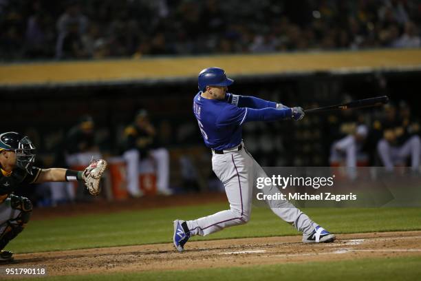 Ryan Rua of the Texas Rangers bats during the game against the Oakland Athletics at the Oakland Alameda Coliseum on April 4, 2018 in Oakland,...