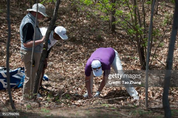 Marcus Fraser of Australia finds a ball during the second round of the 2018 Volvo China open at Beijing Huairou Topwin Golf and Country Club on April...