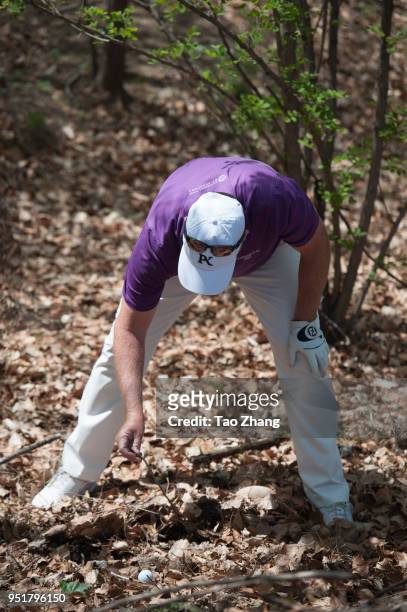 Marcus Fraser of Australia finds a ball during the second round of the 2018 Volvo China open at Beijing Huairou Topwin Golf and Country Club on April...