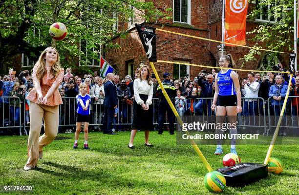 The Dutch Princess Amalia and Alexia play volley during the King's Day in Groningen, on April 27, 2018. - King Willem-Alexander celebrated his 51th...