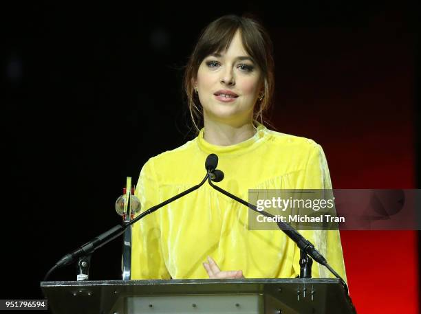 Dakota Johnson accepts the Female of the Year award onstage during the CinemaCon presents The 2018 Big Screen Achievement Awards held at The...