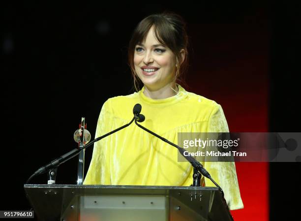 Dakota Johnson accepts the Female of the Year award onstage during the CinemaCon presents The 2018 Big Screen Achievement Awards held at The...
