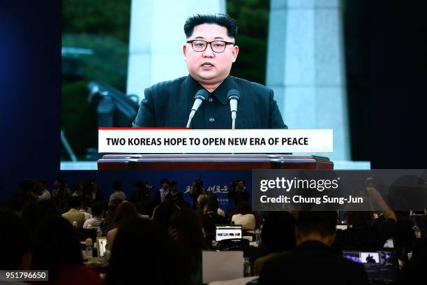 Huge screen shows live video of North Korean leader Kim Jong Un at a press center for the Inter Korean Summit on April 27, 2018 in Goyang, South...