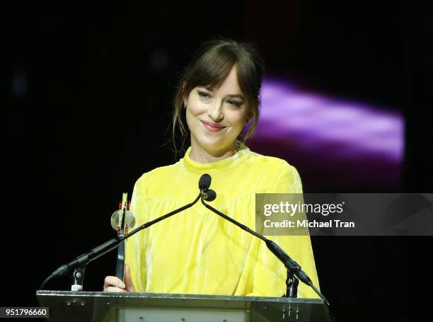 Dakota Johnson accepts the Female of the Year award onstage during the CinemaCon presents The 2018 Big Screen Achievement Awards held at The...