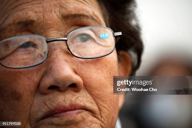 South Korean Buddhist participates in a prayer service wishing for a successful Inter-Korean Summit and peace for the country on April 27, 2018 in...