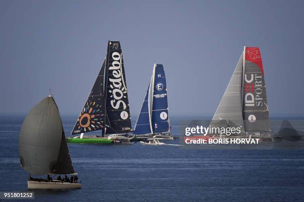 French skippers Thomas Coville on "Sodebo", Yves Le Blevec on "Grand Large Emotion" and Francis Joyon on "IDEC" leave Marseille during the prologue...