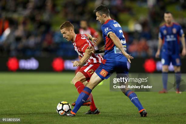 Jason Hoffman of the Jets contests the ball against Oliver Bozanic of Melbourne City during the A-League Semi Final match between the Newcastle Jets...