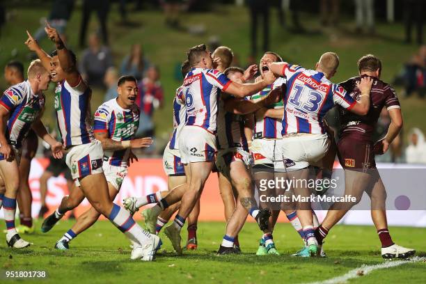 Nathan Ross of the Knights celebrates scoring a try with team mates during the Round eight NRL match between the Manly-Warringah Sea Eagles and the...