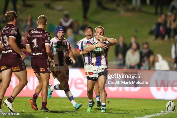 Nathan Ross of the Knights celebrates scoring a try during the Round eight NRL match between the Manly-Warringah Sea Eagles and the Newcastle Knights...