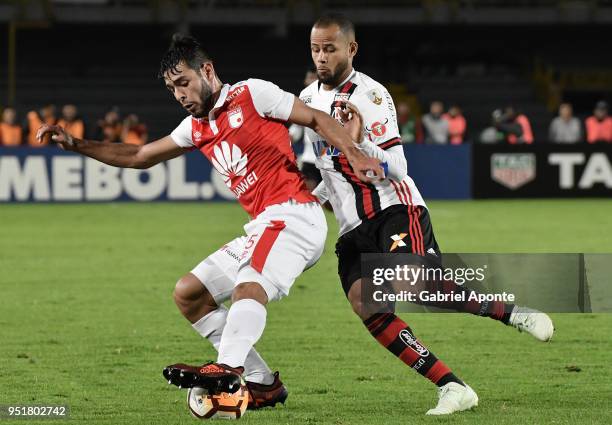 Nicolas Gil of Santa Fe vies for the ball with Geuvanio player of Flamengo during a match between Independiente Santa Fe and Flamengo as part of Copa...