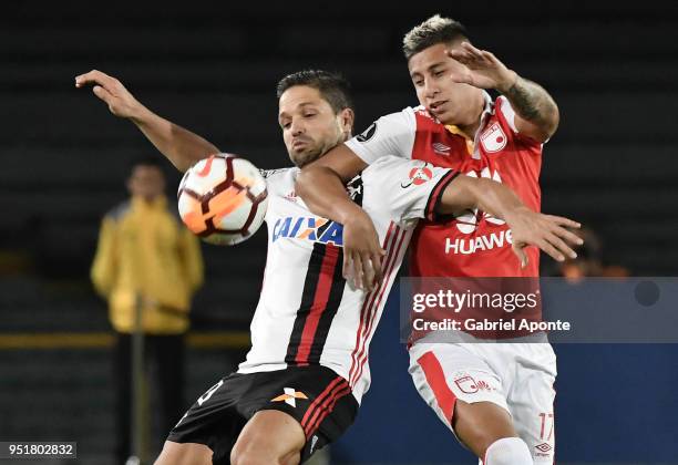 Juan Daniel Roa of Santa Fe vies for the ball with Diego Alves of Flamengo during a match between Independiente Santa Fe and Flamengo as part of Copa...