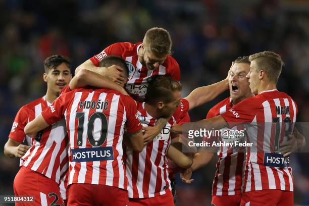 Melbourne City players celebrate an own goal from Nikolai Topor-Stanley during the A-League Semi Final match between the Newcastle Jets and Melbourne...
