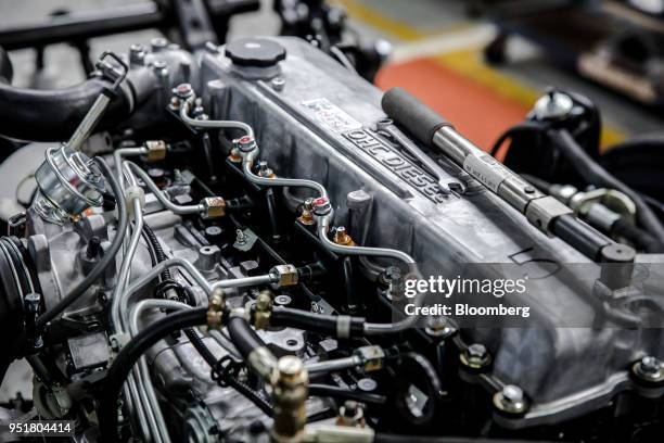 An Isuzu OHC diesel engine sits ready for installation into a truck on the assembly line inside the Isuzu East Africa Ltd. Plant in Nairobi, Kenya,...