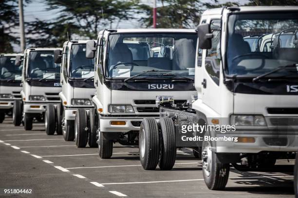 Completed Isuzu FRR 33L F-Series trucks sit parked ready for shipment at the Isuzu East Africa Ltd. Plant in Nairobi, Kenya, on Thursday, April 26,...