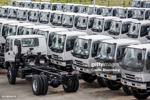 Completed Isuzu FTS 33H F-Series trucks sit parked ready for shipment at the Isuzu East Africa Ltd. Plant in Nairobi, Kenya, on Thursday, April 26,...