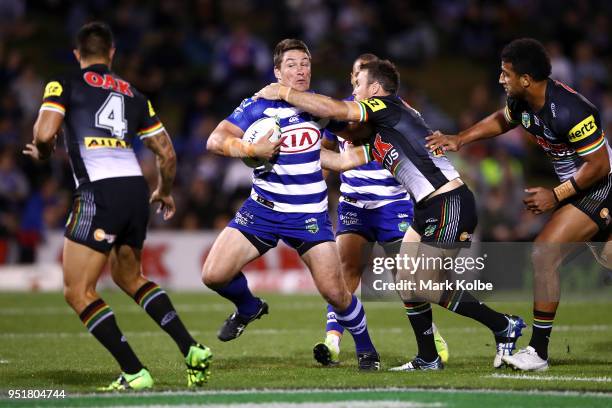 Josh Jackson of the Bulldogs is tackled during the NRL round eight match between the Penrith Panthers and Canterbury Bulldogs on April 27, 2018 in...