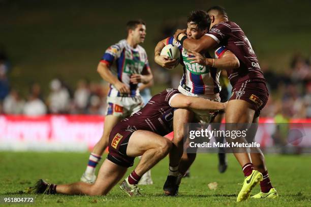 Aidan Guerra of the Knights is tackled during the Round eight NRL match between the Manly-Warringah Sea Eagles and the Newcastle Knights at Lottoland...