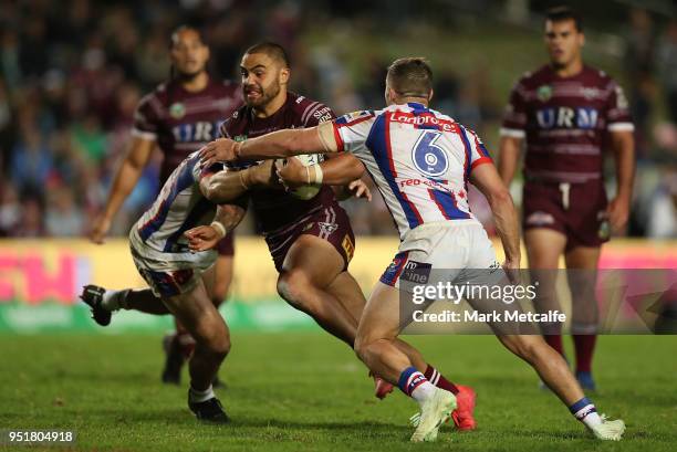 Dylan Walker of the Sea Eagles is tackled during the Round eight NRL match between the Manly-Warringah Sea Eagles and the Newcastle Knights at...