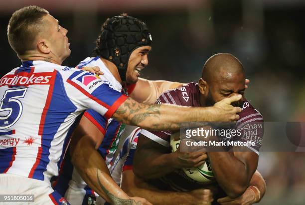 Akuila Uate of the Sea Eagles is tackled during the Round eight NRL match between the Manly-Warringah Sea Eagles and the Newcastle Knights at...