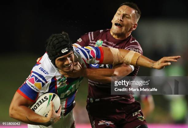 Sione MataÕutia of the Knights is tackled during the Round eight NRL match between the Manly-Warringah Sea Eagles and the Newcastle Knights at...