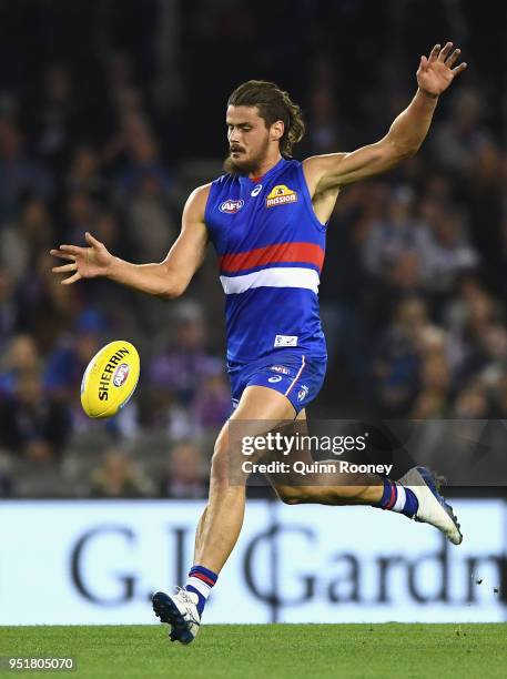 Tom Boyd of the Bulldogs kicks during the AFL round six match between the Western Bulldogs and Carlton Blues at Etihad Stadium on April 27, 2018 in...