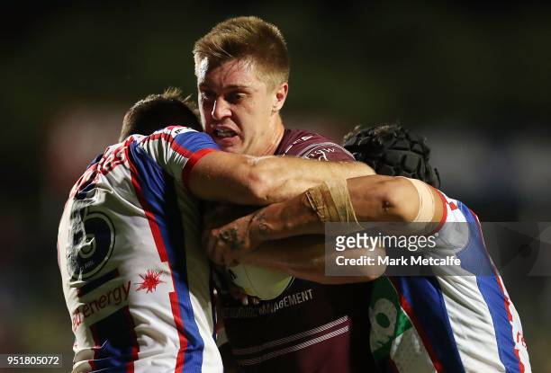 Shaun Lane of the Sea Eagles is tackled during the Round eight NRL match between the Manly-Warringah Sea Eagles and the Newcastle Knights at...