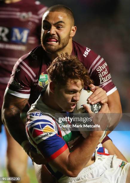 Kalyn Ponga of the Knights is tackled by Dylan Walker of the Sea Eagles during the Round eight NRL match between the Manly-Warringah Sea Eagles and...