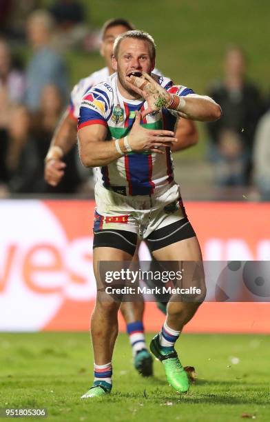 Nathan Ross of the Knights celebrates scoring a try during the Round eight NRL match between the Manly-Warringah Sea Eagles and the Newcastle Knights...