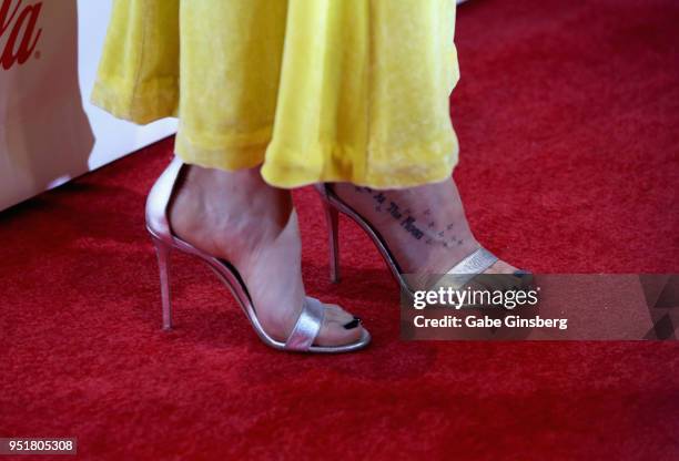 Recipient of the "Female Star of the Year" award actress Dakota Johnson, tattoo, shoes detail, attends the CinemaCon Big Screen Achievement Awards at...