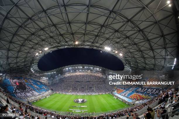 Picture taken with a fisheye lens on April 26, 2018 shows spectators watching the ceremony ahead of the UEFA Europa League first-leg semi-final...