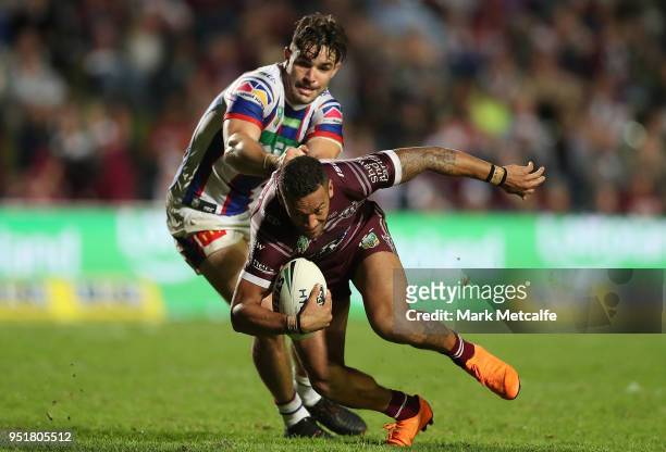 Apisai Koroisau of the Sea Eagles is tackled during the Round eight NRL match between the Manly-Warringah Sea Eagles and the Newcastle Knights at...