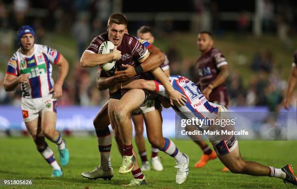 Shaun Lane of the Sea Eagles is tackled during the Round eight NRL match between the Manly-Warringah Sea Eagles and the Newcastle Knights at...
