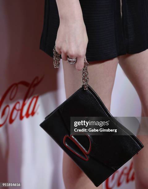 Recipient of the "Cinema Spotlight Award" actress Anna Kendrick, ring, purse detail, attends the CinemaCon Big Screen Achievement Awards at Omnia...