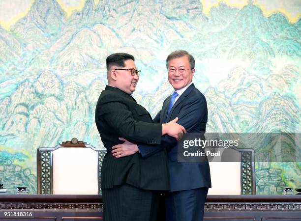 North Korean leader Kim Jong Un and South Korean President Moon Jae-in embrace after signing the Panmunjom Declaration for Peace, Prosperity and...