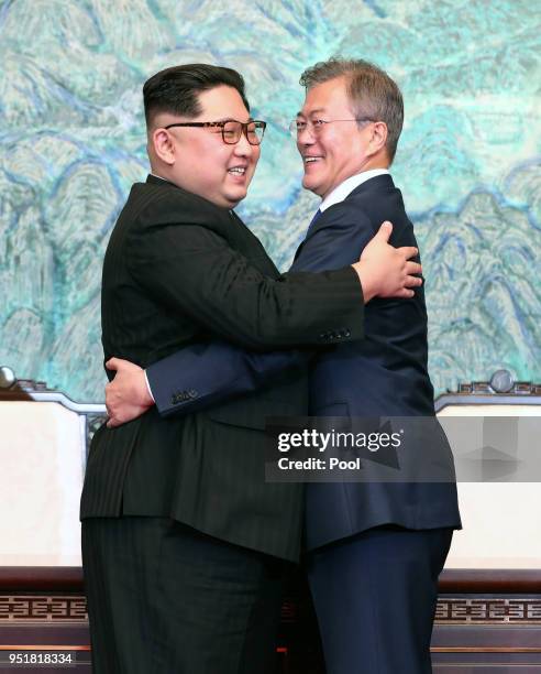 North Korean leader Kim Jong Un and South Korean President Moon Jae-in embrace after signing the Panmunjom Declaration for Peace, Prosperity and...