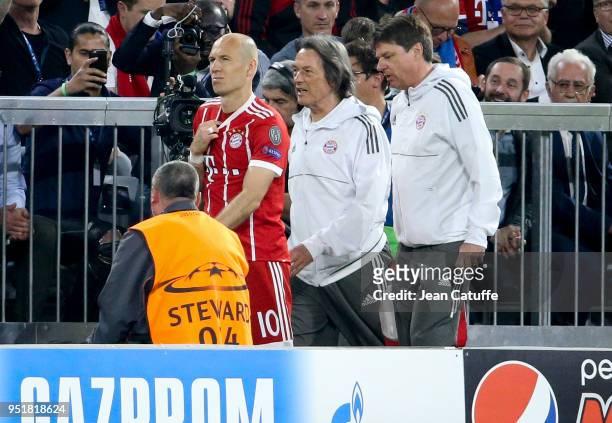 Injured, Arjen Robben of Bayern Munich leaves the pitch with Doctor of Bayern Munich Hans-Wilhelm Muller-Wohlfahrt during the UEFA Champions League...