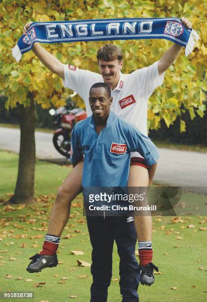 England players Ian Wright and Matthew Le Tissier take part in a tabloid picture set up with an England scarf during an International get together...