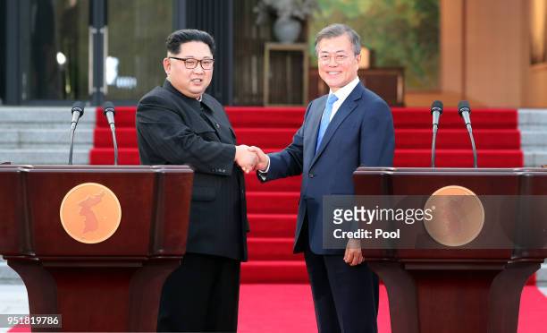 North Korean leader Kim Jong Un and South Korean President Moon Jae-in shake hands after announcing the Panmunjom Declaration for Peace, Prosperity...
