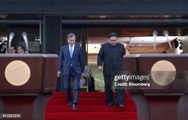 Kim Jong Un, North Korea's leader, right, and Moon Jae-in, South Korea's president, walk towards their podiums ahead of a news conference at the...