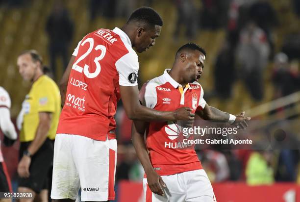 Javier Lopez, and Carlos Arboleda players of Santa Fe look disappointed after a match between Independiente Santa Fe and Flamengo as part of Copa...