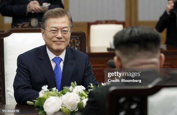 Moon Jae-in, South Korea's president, left, sits across from Kim Jong Un, North Korea's leader, during the inter-Korean summit at the Peace House in...