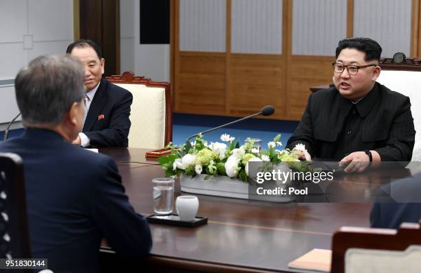 North Koraen Leader Kim Jong Un speaks with South Korean President Moon Jae-in during the Inter-Korean Summit at the Peace House on April 27, 2018 in...