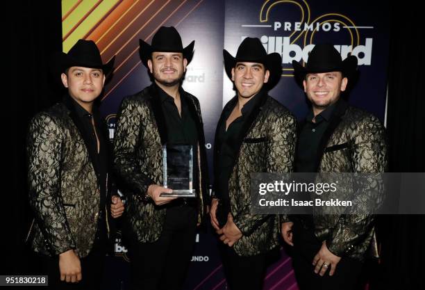 Calibre 50 poses with an award in the press room at the 2018 Billboard Latin Music Awards at the Mandalay Bay Events Center on April 26, 2018 in Las...