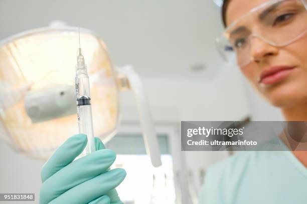 dentistry tooth extraction dentist working dental tooth extraction forceps patient point of view - tooth extraction stock pictures, royalty-free photos & images