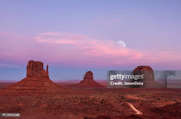 sunset and moon rise at monument valley - desert sunset stock pictures, royalty-free photos & images