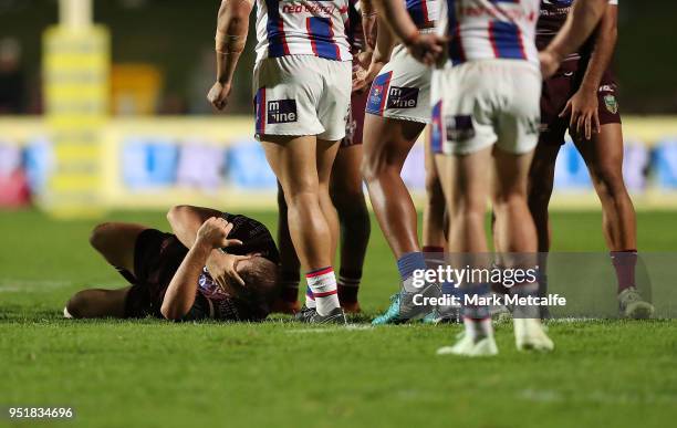 Lachlan Crocker of the Sea Eagles lays down injured during the Round eight NRL match between the Manly-Warringah Sea Eagles and the Newcastle Knights...